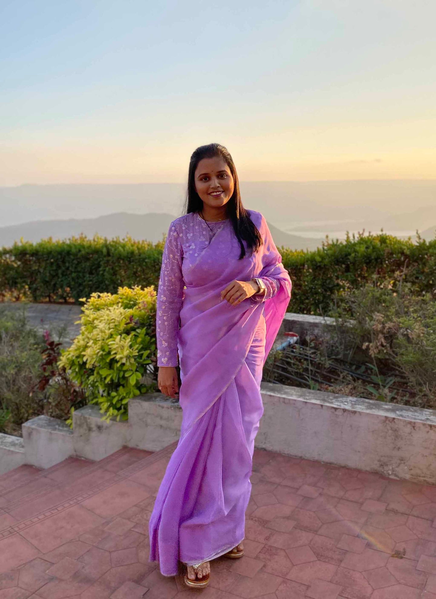 A woman wearing Lilac Plain Georgette Organza Saree