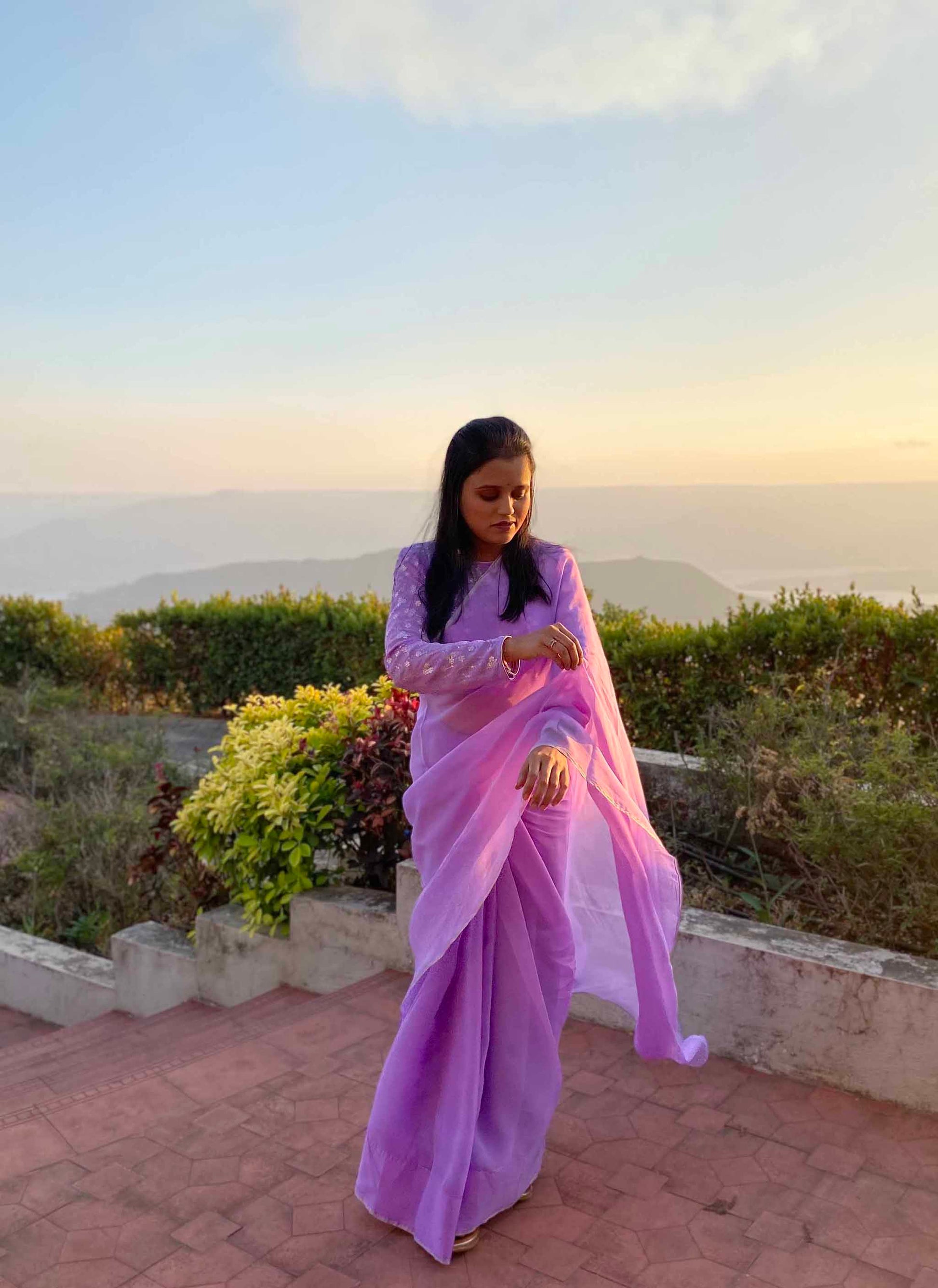 A woman wearing Lilac Plain Georgette Organza Saree