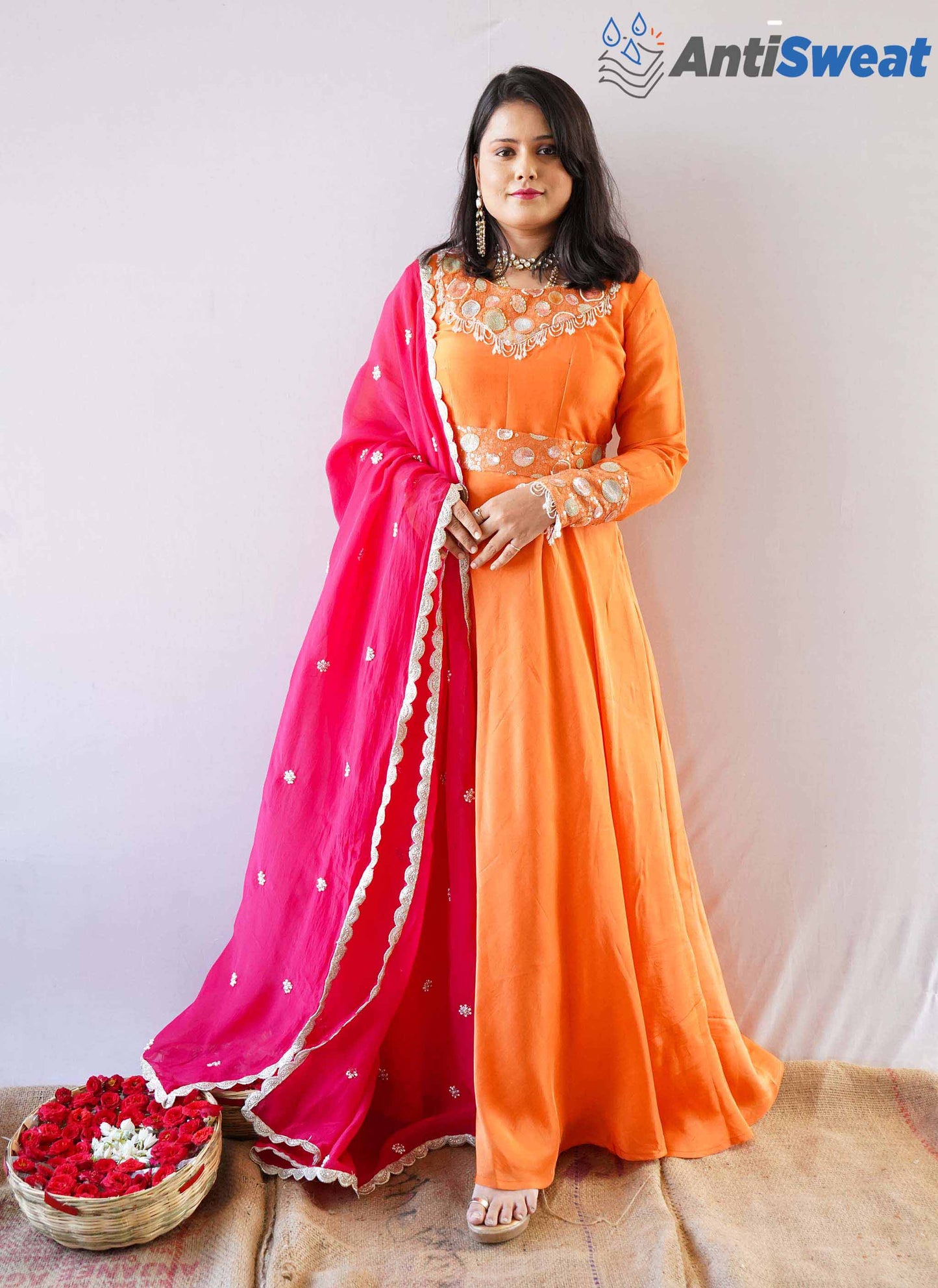 A woman wearing Orange AntiSweat Gown Set