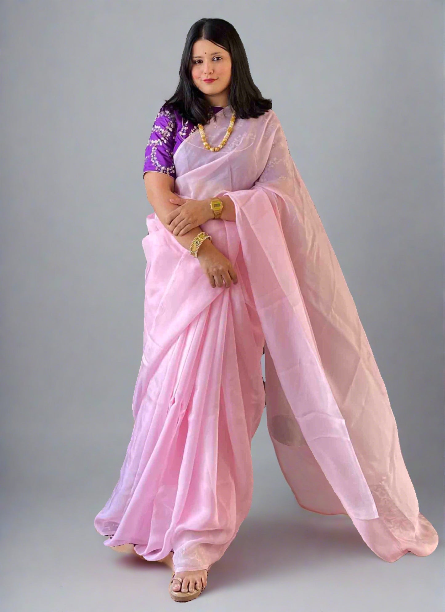 A woman wearing Pink Plain Saree