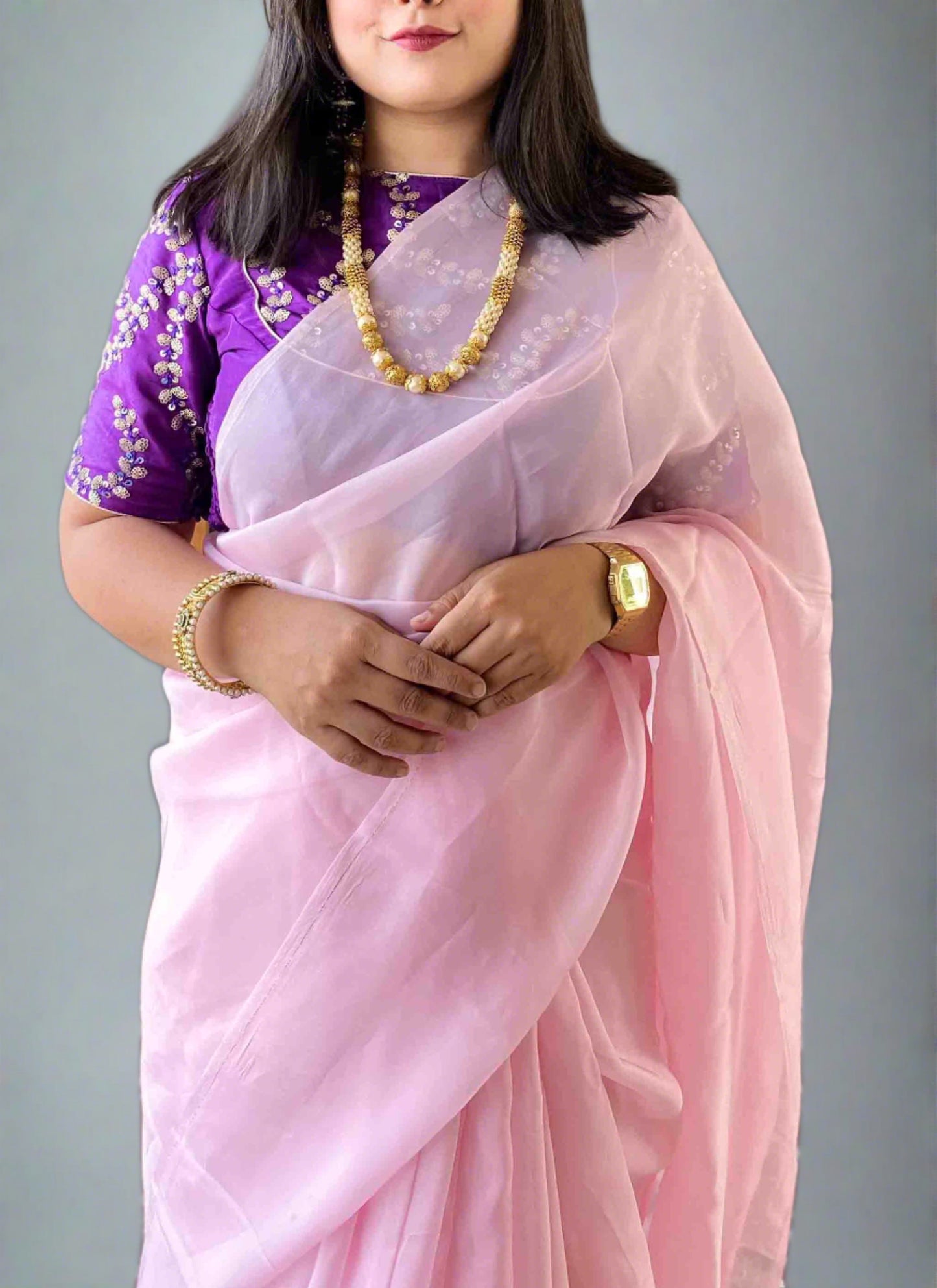 A woman wearing Pink Plain Saree