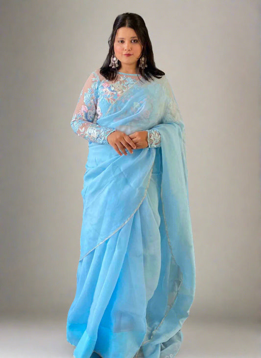 A woman wearing Blue Plain Saree