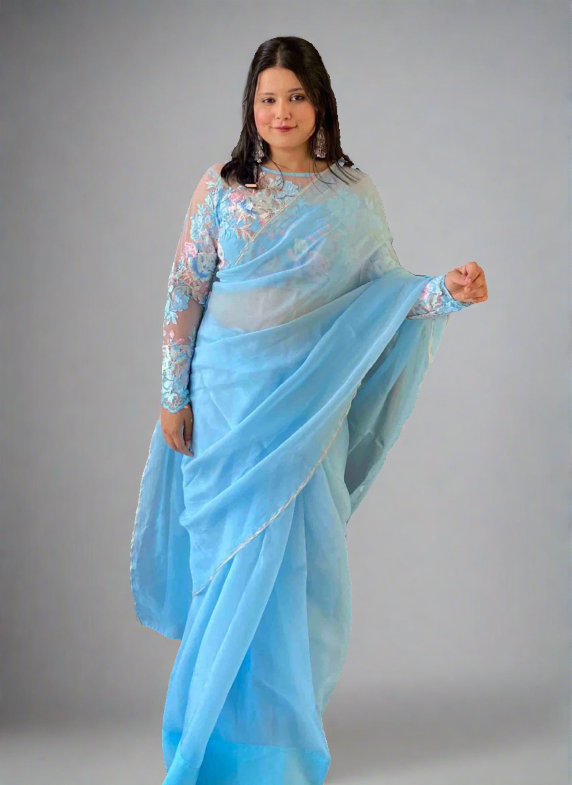 A woman wearing Blue Plain Saree