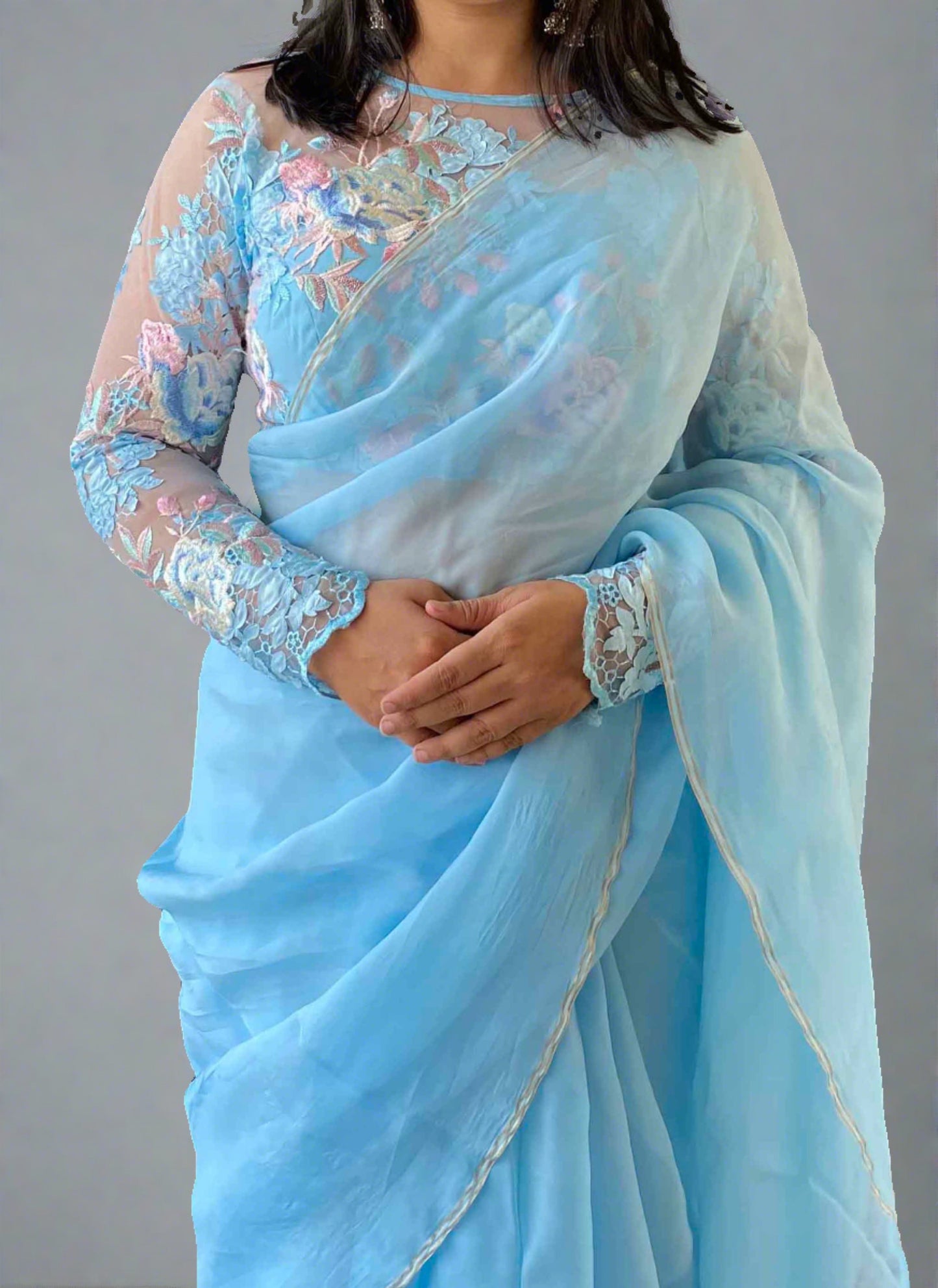 A woman wearing Blue Plain Saree