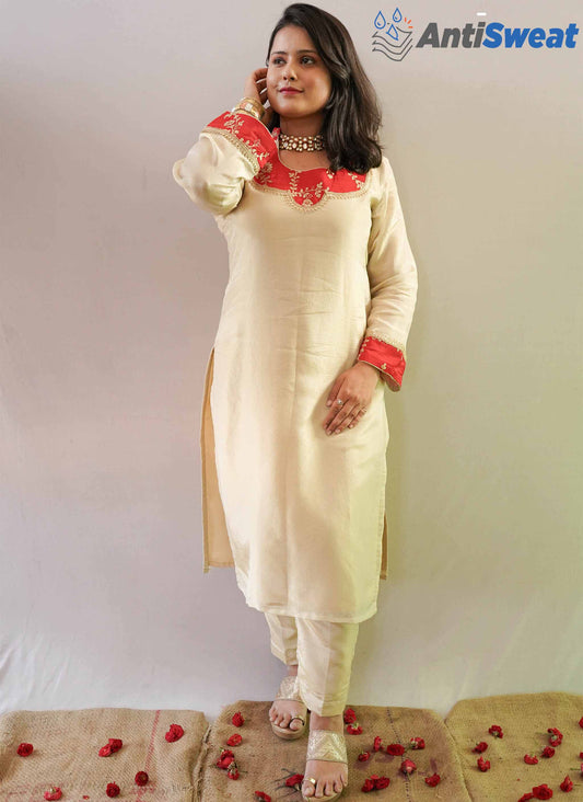 A women wearing Golden Banarasi Tissue AntiSweat Kurti Set