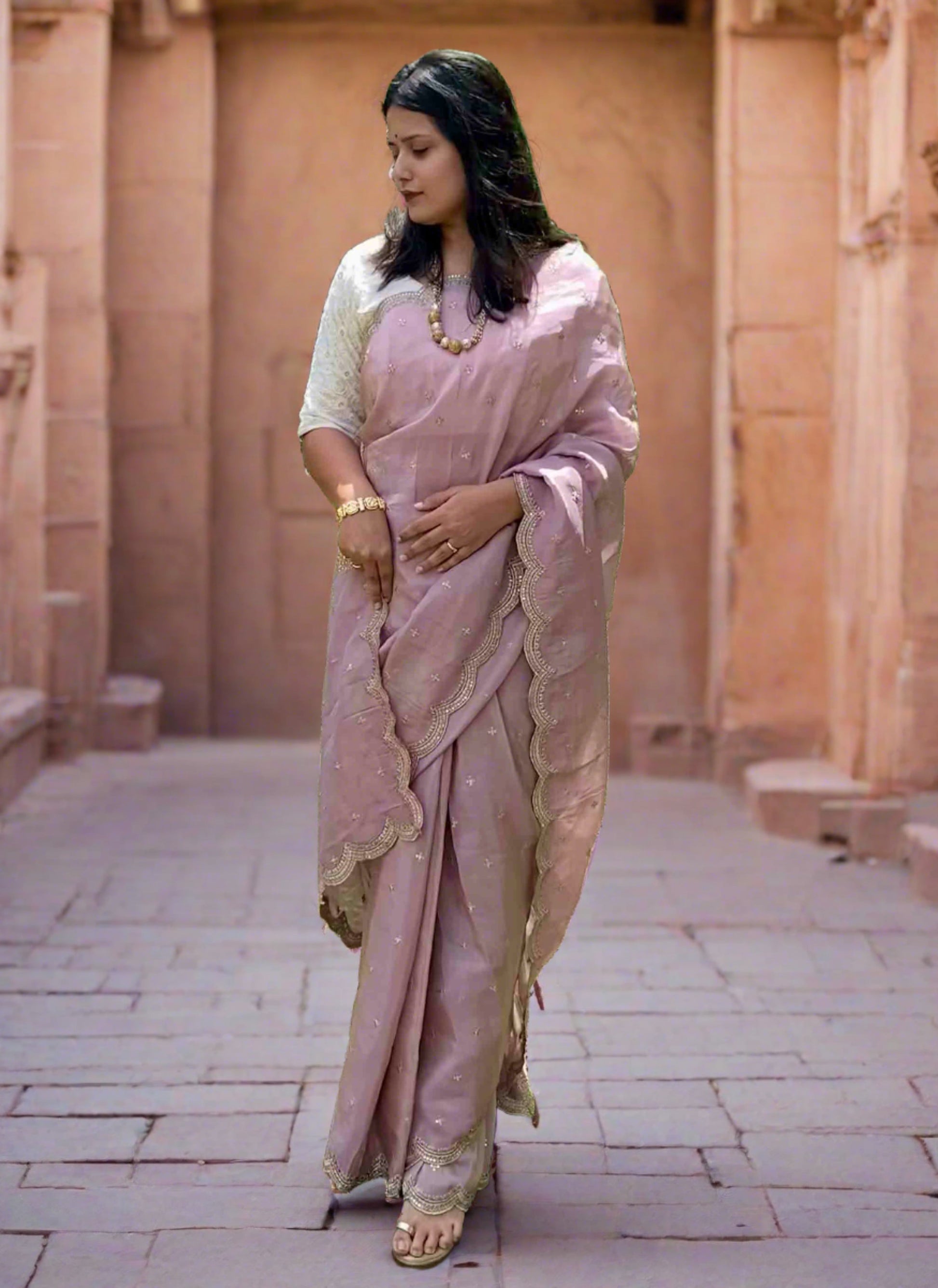 A woman wearing Lilac Banarasi Tissue Saree