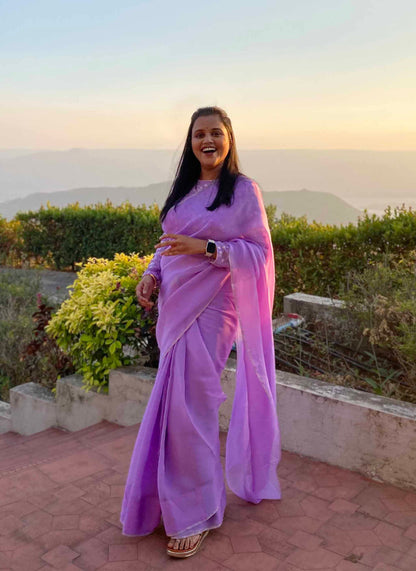 A woman wearing Lilac Plain Georgette Organza Saree