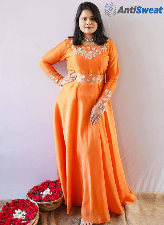 A woman wearing Orange AntiSweat Gown