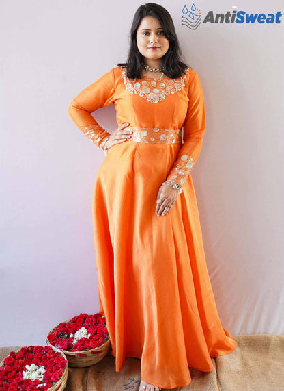 A woman wearing Orange AntiSweat Gown