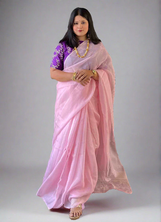 A woman wearing Pink Plain Saree