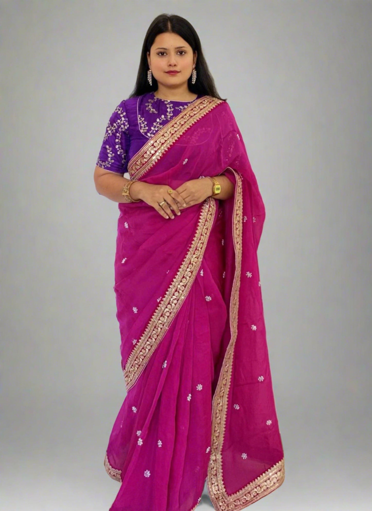 A woman wearing Pink Pearl Handwork Saree