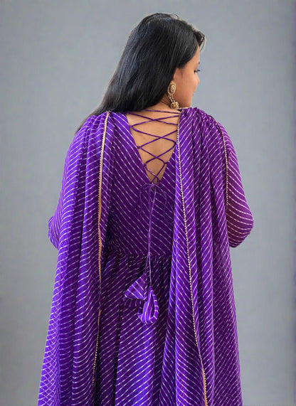 A woman wearing Purple Leheriya Kurta Set