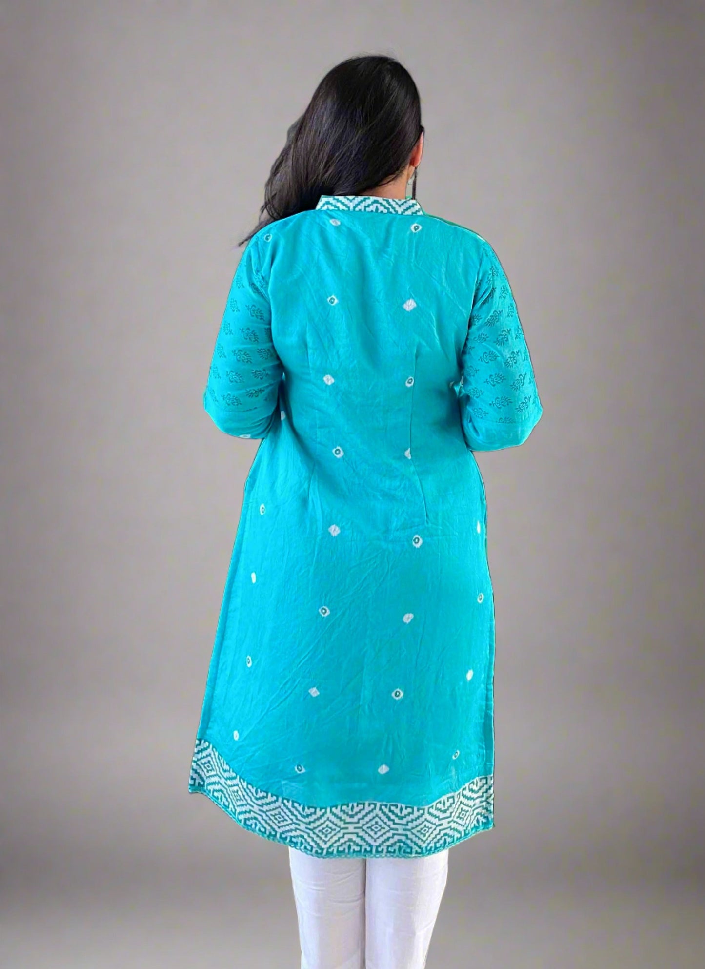 A woman wearing Turquoise Printed Mul Cotton Kurti