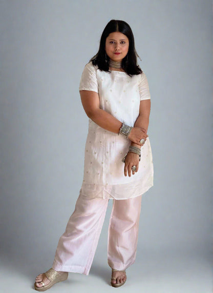 A woman wearing White Organza Kurti