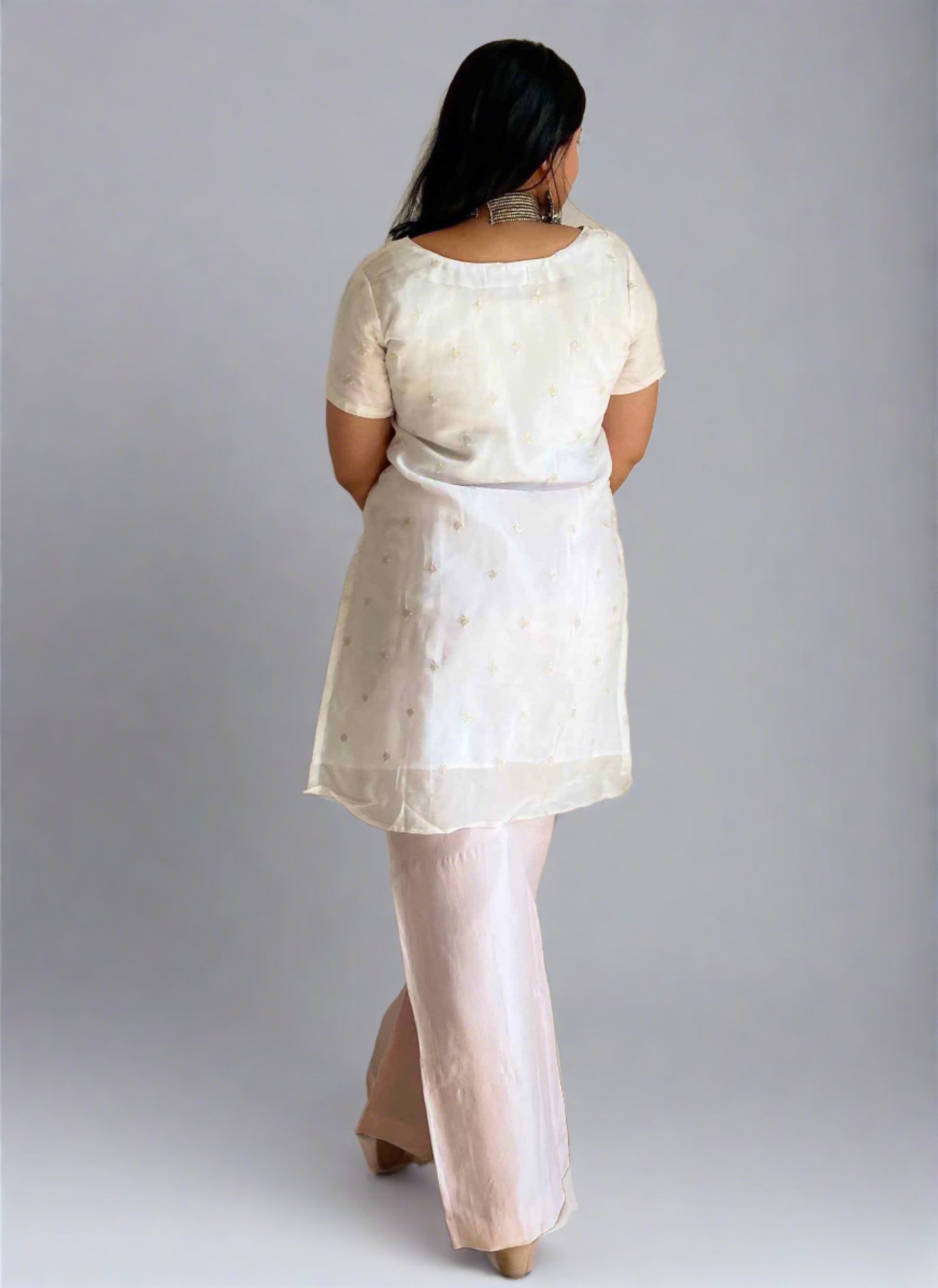 A woman wearing White Organza Kurti