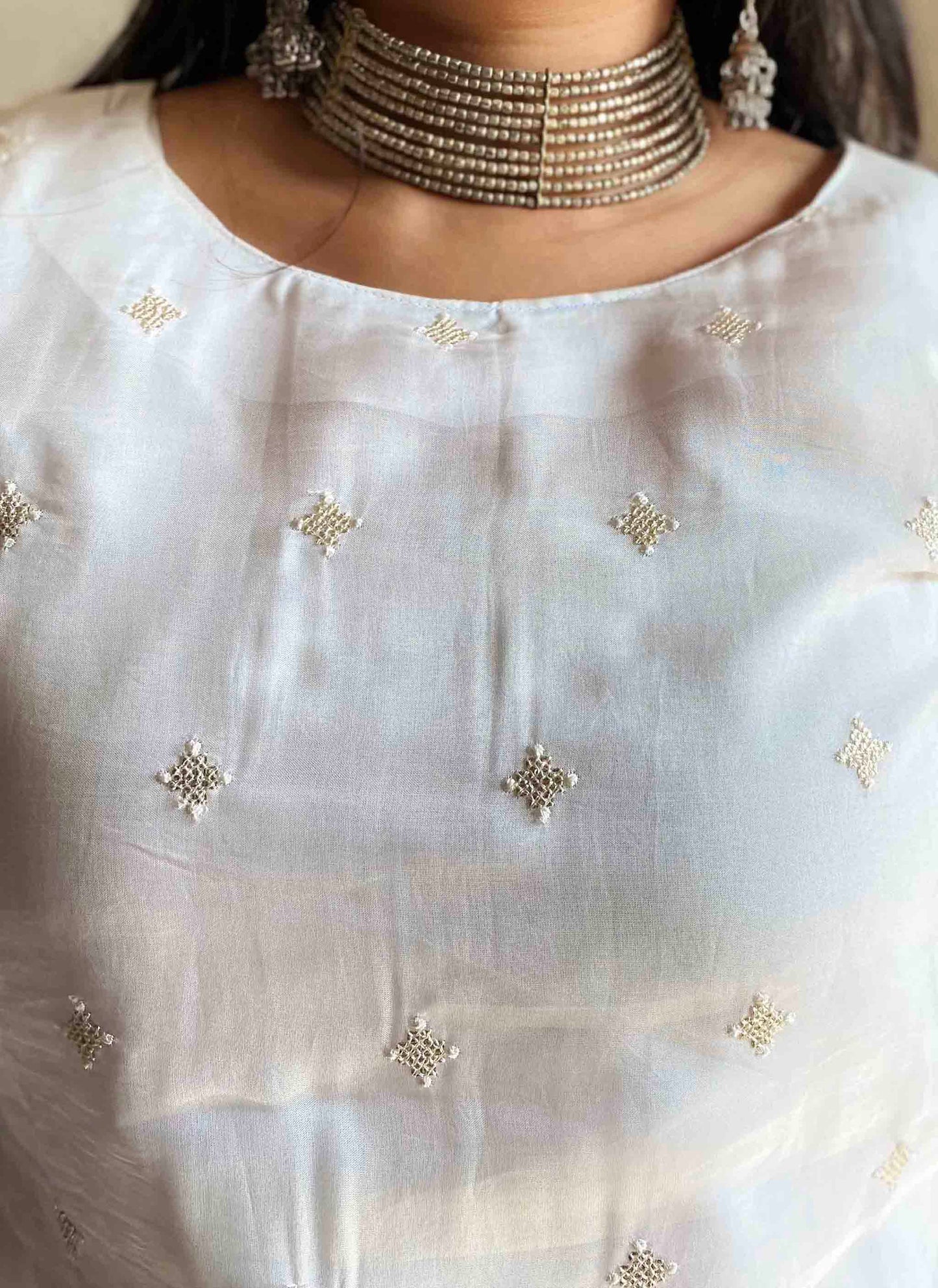 A woman wearing White Organza Kurti