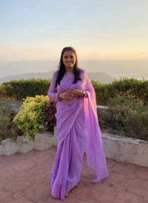 A woman wearing Lilac Plain Georgette Organza Saree